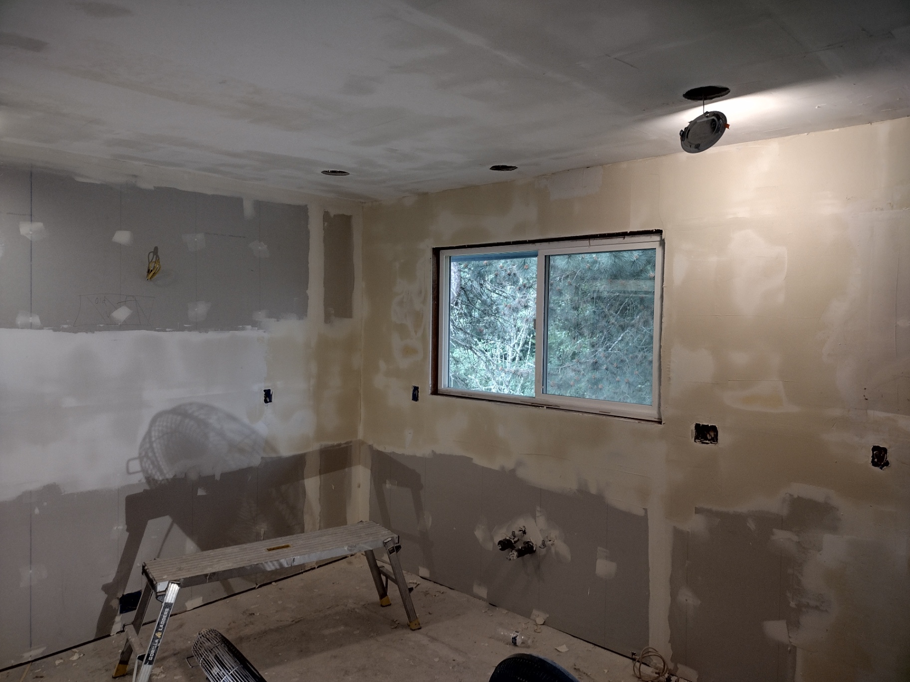 Kitchen remodel in progress showing fresh drywall and electrical rough-in in NW Oregon